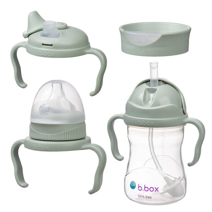 Set of baby feeding and drinking products including a bottle, sippy cup, and trainer cup with handles on a white background.