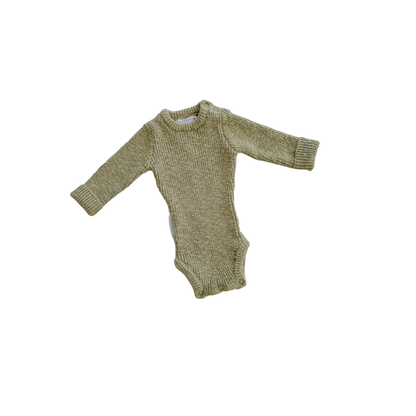 Green baby onesie on a white background