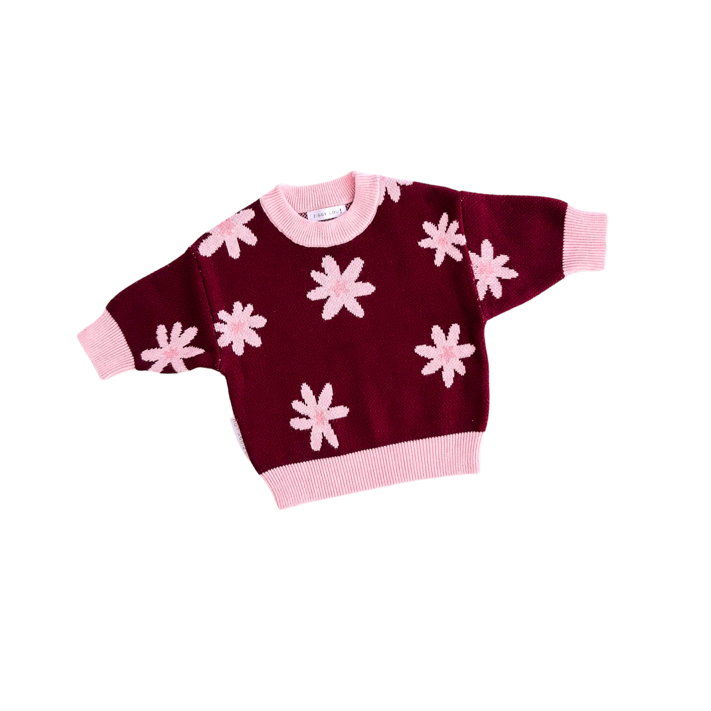 Maroon sweater with pink flower patterns on a white background