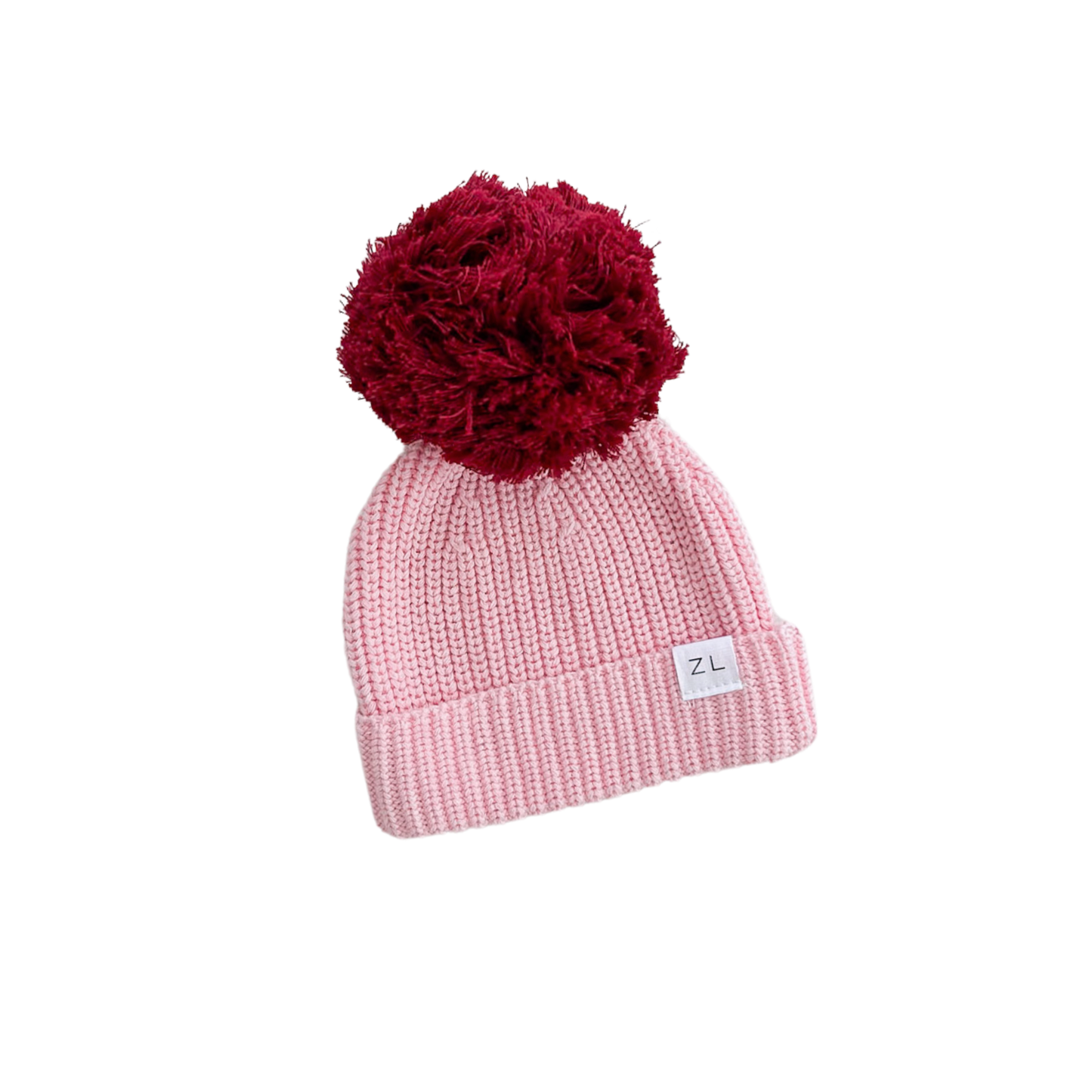 Pink beanie with a red pom-pom on a white background