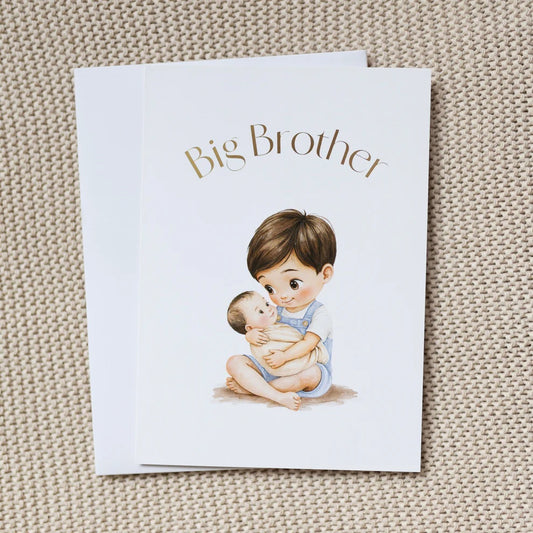 Card with illustration of a big brother holding a baby, on a textured beige surface.