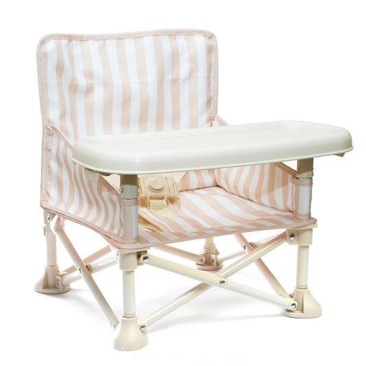 Foldable chair with striped cushion on a white background