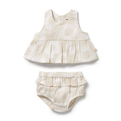 Baby dress and bloomers set on a white background