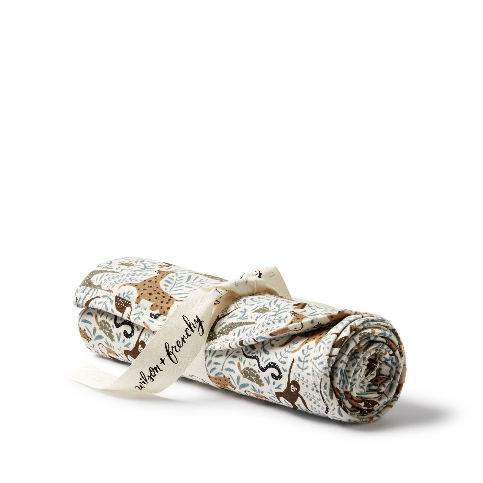 Roll of fabric with animal pattern and 'Waldorf & Friends' branding on a white background
