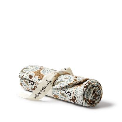 Roll of fabric with animal pattern and 'Waldorf & Friends' branding on a white background
