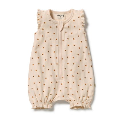 A baby sleeveless romper in cream-colored ribbed fabric with a small brown polka dot pattern, featuring ruffled shoulders and leg cuffs, laid flat on a white background.