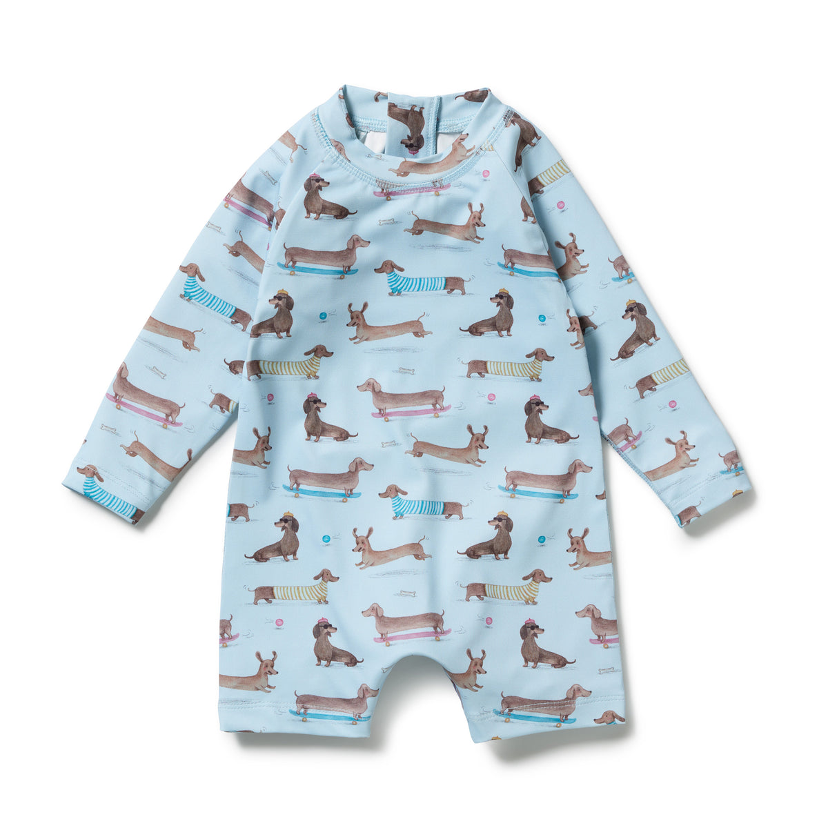 A light blue long-sleeve baby romper with an all-over print of dachshund dogs on skates, shown flat against a white background.