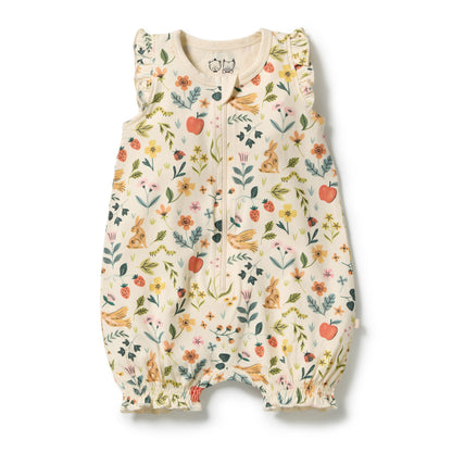 A baby sleeveless zip-up sleeper with ruffled shoulder straps and elastic leg cuffs, featuring a whimsical multicolor print of flowers, rabbits, birds, and strawberries on a cream background.