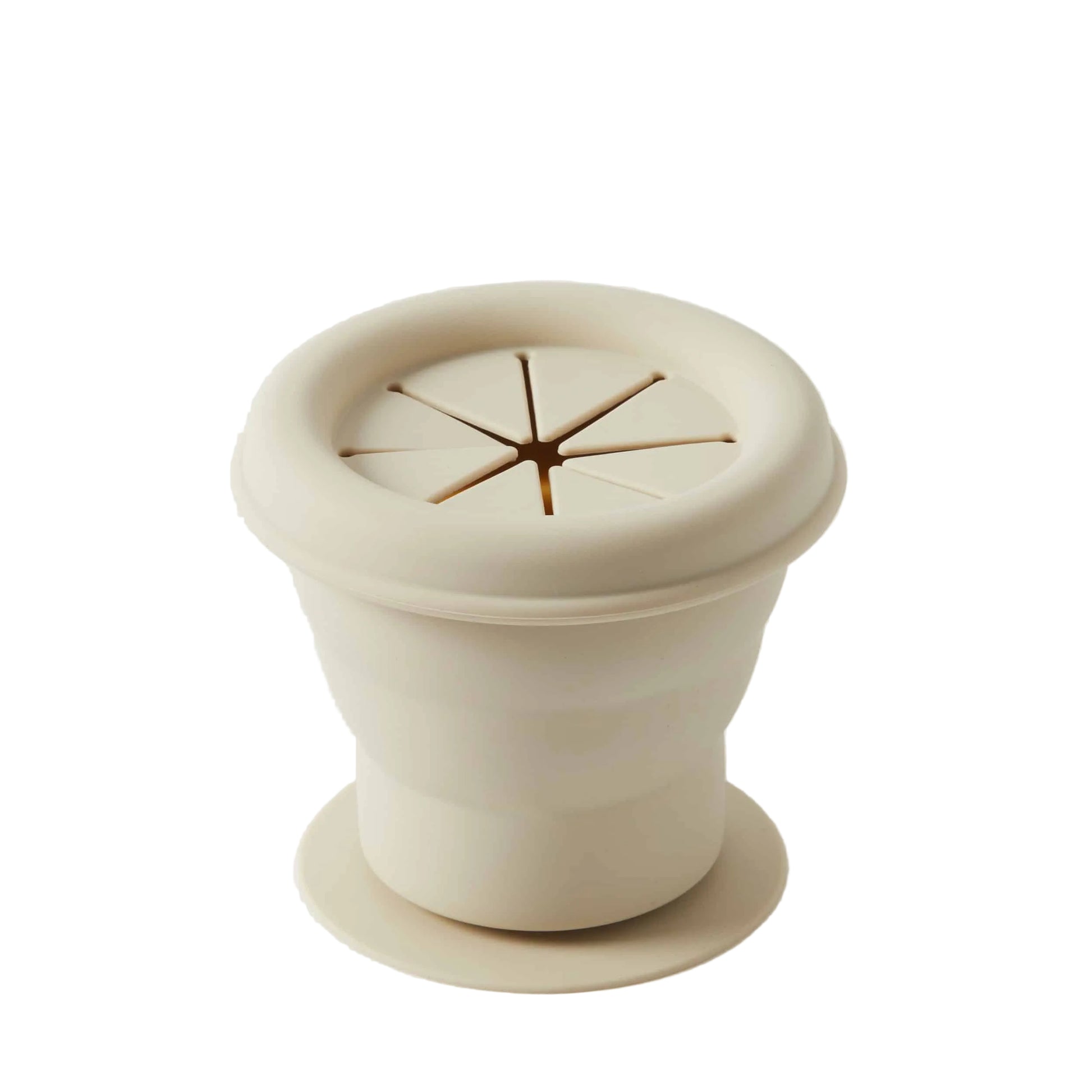 Beige ceramic pot with lid on a white background