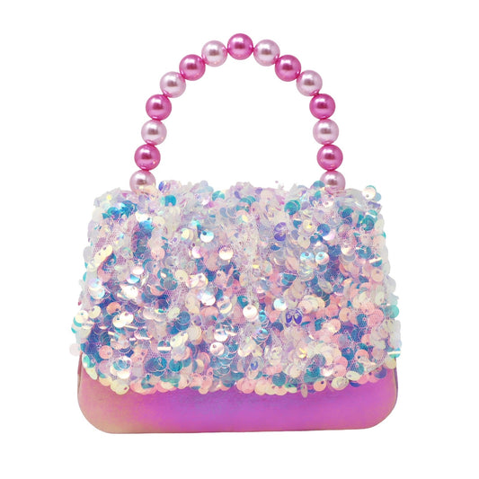 Sparkly handbag with pink beaded handle on a white background