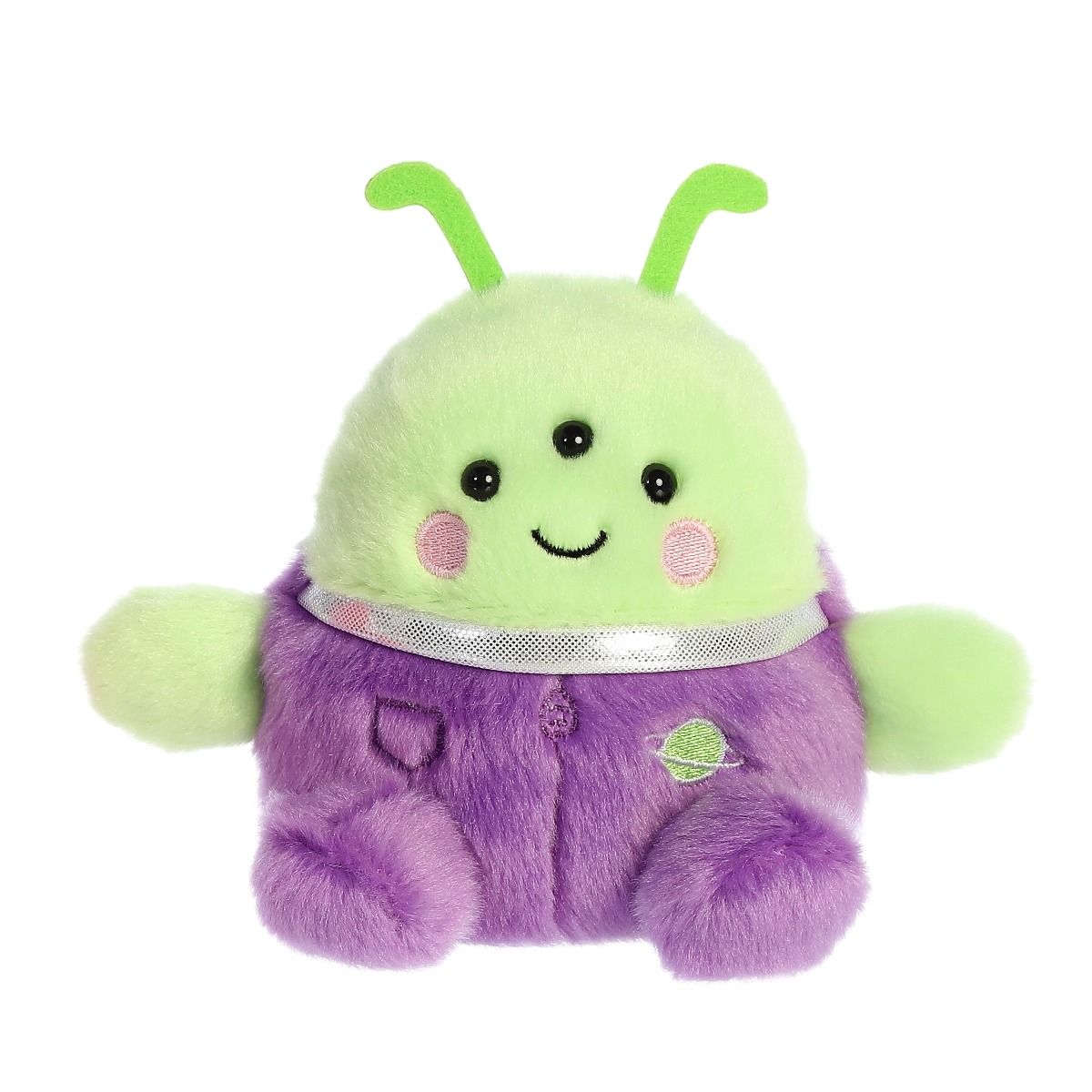 Plush toy with green body and purple overalls on a white background