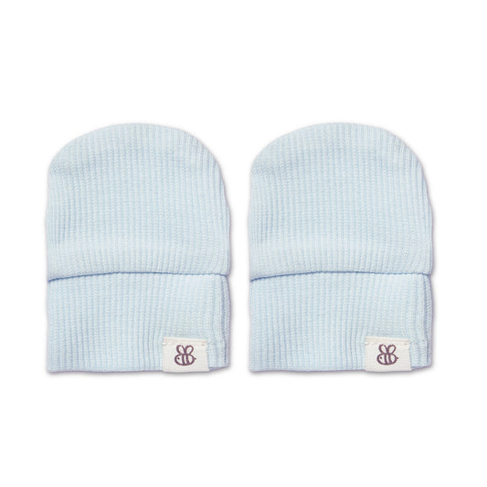 A pair of light blue ribbed knit baby beanie hats with a small white brand patch on the cuff, displayed side-by-side on a white background.