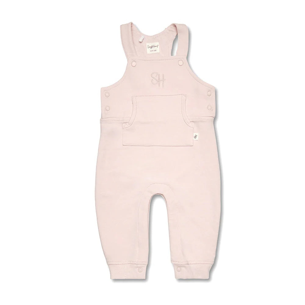 Pink baby overalls on a white background