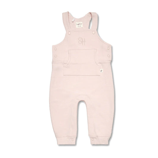 Pink baby overalls on a white background