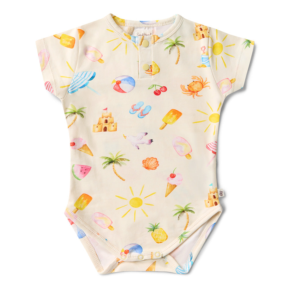 Baby onesie with summer-themed print on a white background