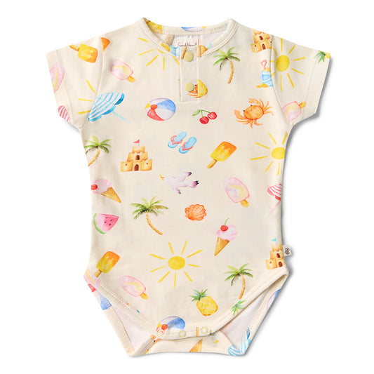 Baby onesie with summer-themed print on a white background