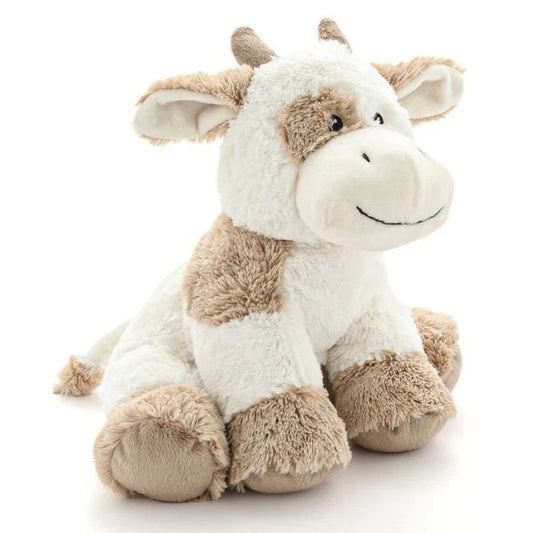 Plush cow toy on a white background