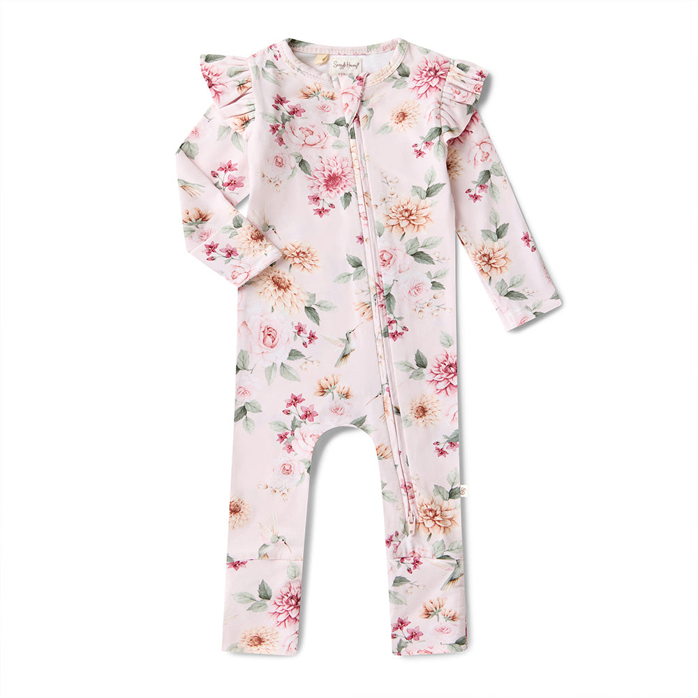 Floral baby onesie with ruffled shoulders on a white background