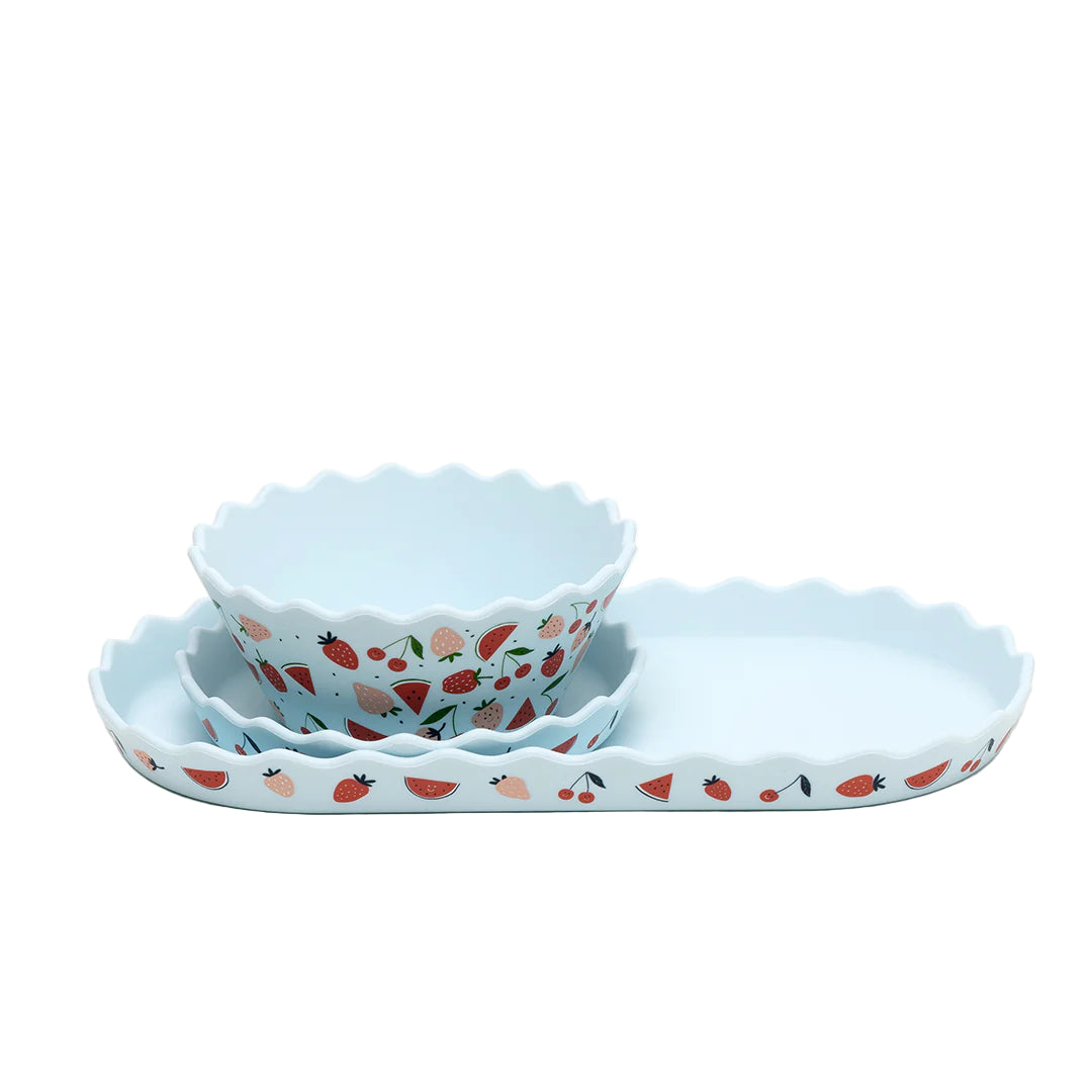Set of three ceramic bowls with strawberry pattern on a white background