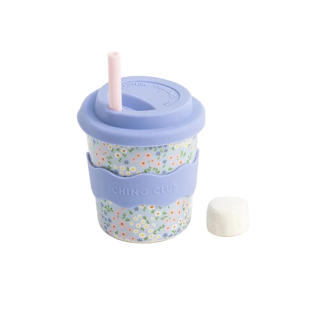 Reusable cup with floral design and purple lid on a white background