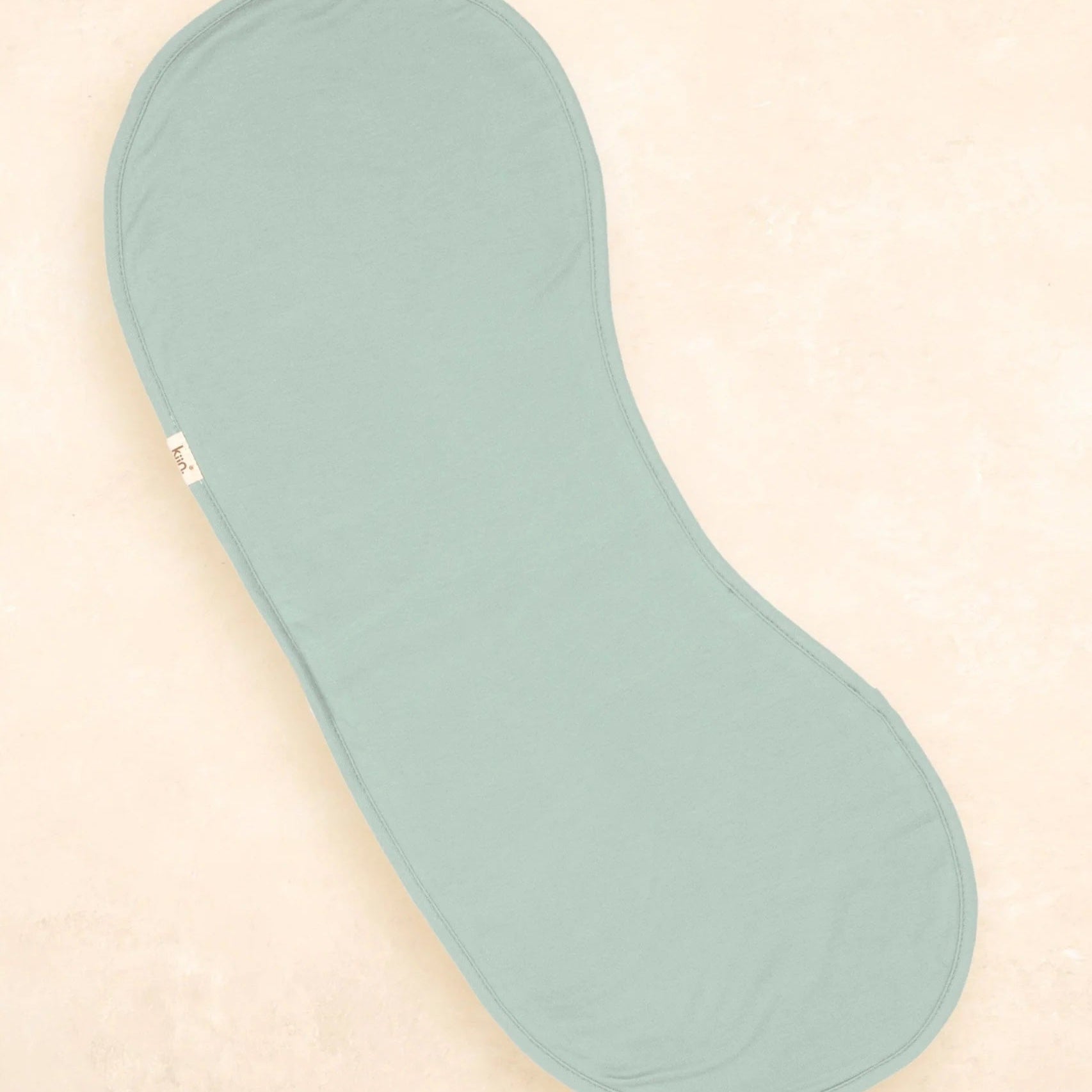 Light blue shoe insole on a beige background
