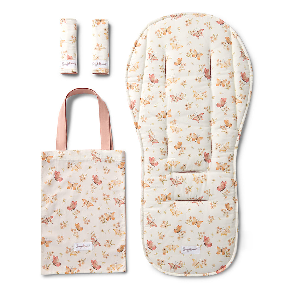 Floral-patterned baby seat cover, changing mat, and tote bag on a white background