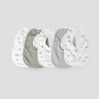 Set of four baby bibs with nature-themed prints on a light gray background