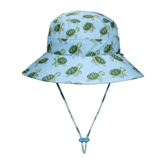 Children's sun hat with turtle pattern on a light blue background