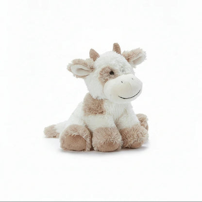 Plush cow toy on a white background