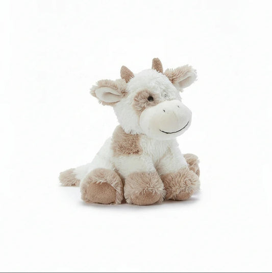 Plush cow toy on a white background