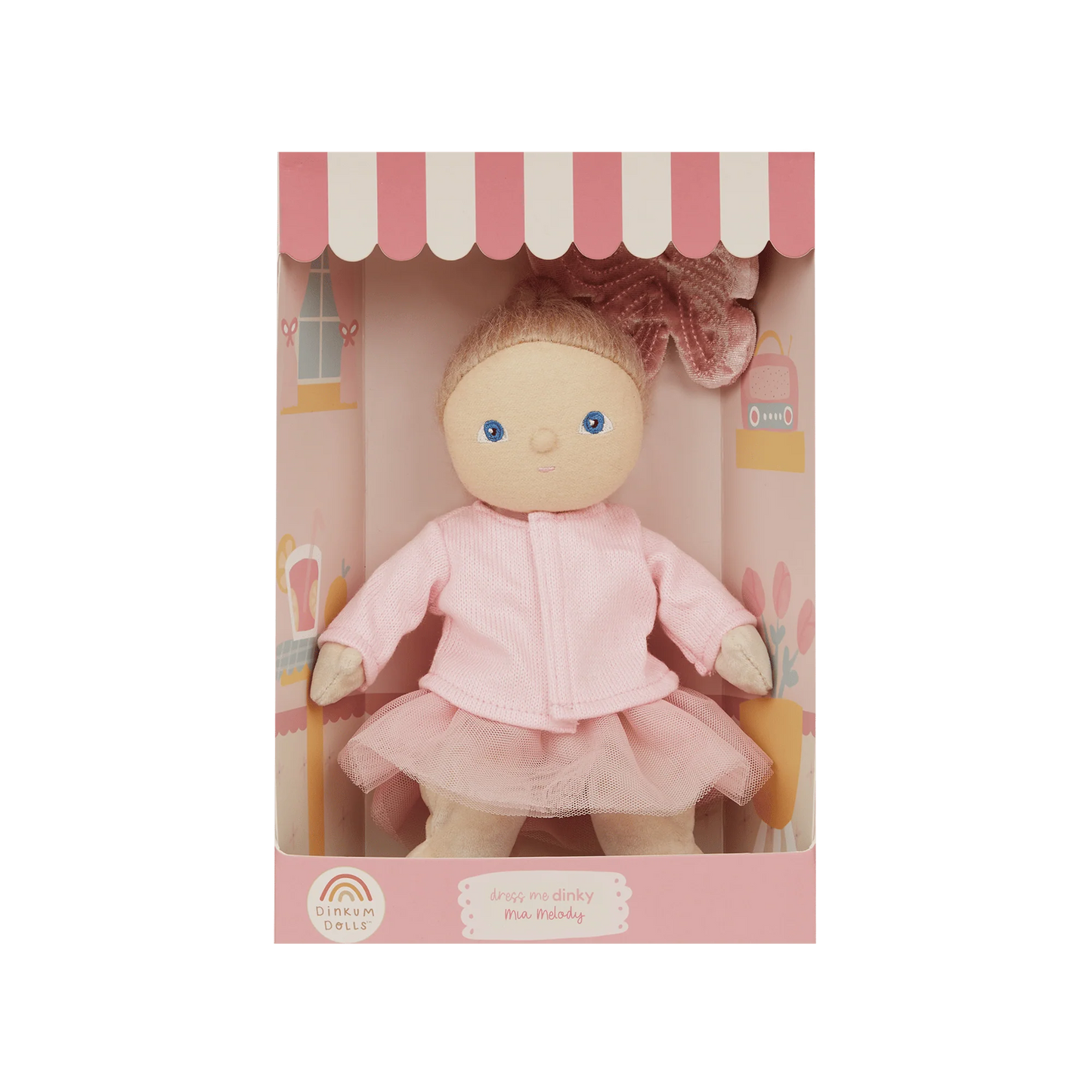 Doll in a pink outfit with a matching box on a white background