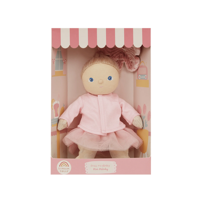 Doll in a pink outfit with a matching box on a white background