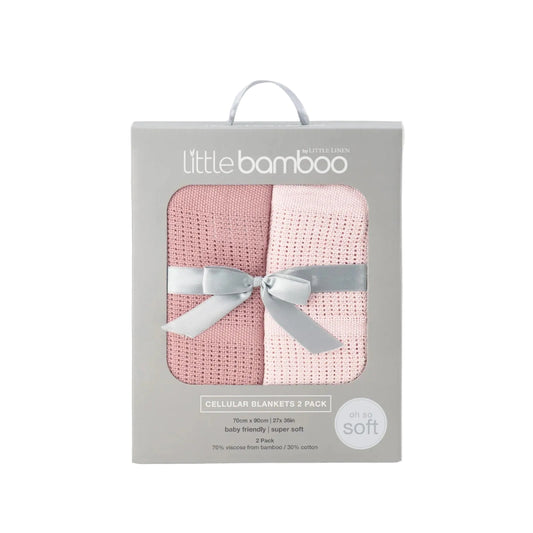 Packaged pink baby blanket with a ribbon in a 'little bamboo' box on a light gray background