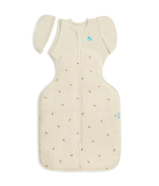 Beige baby sleeping bag with small patterns on a white background