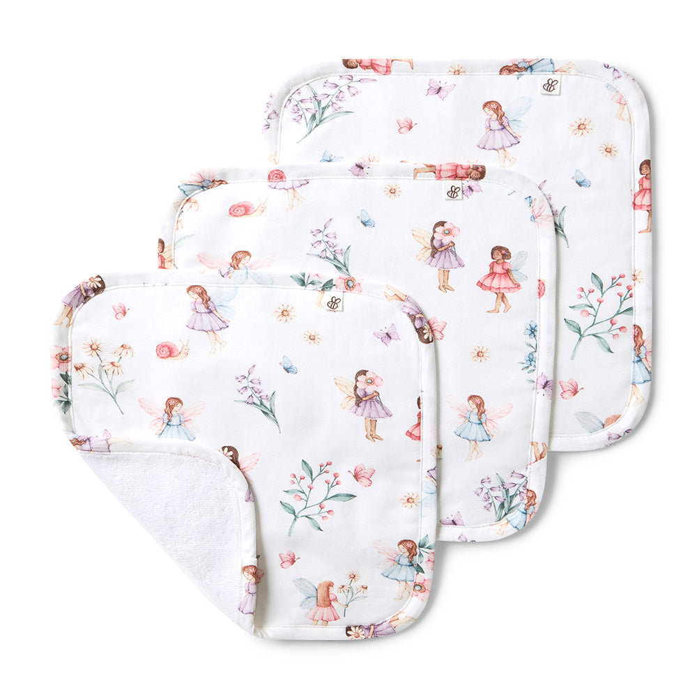 Set of baby burp cloths with fairy design on a white background