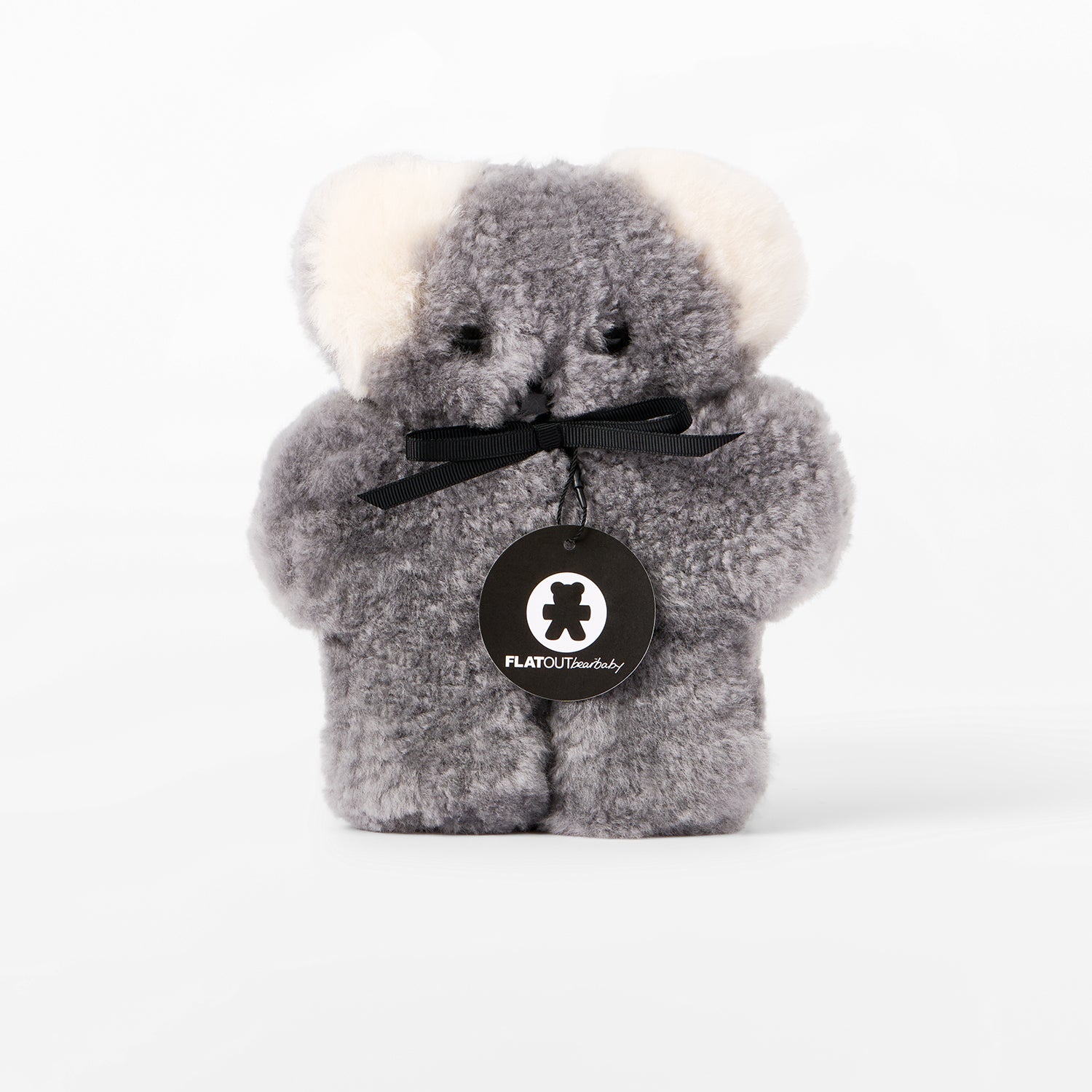Gray plush bear with a black bow and visible brand logo on a white background