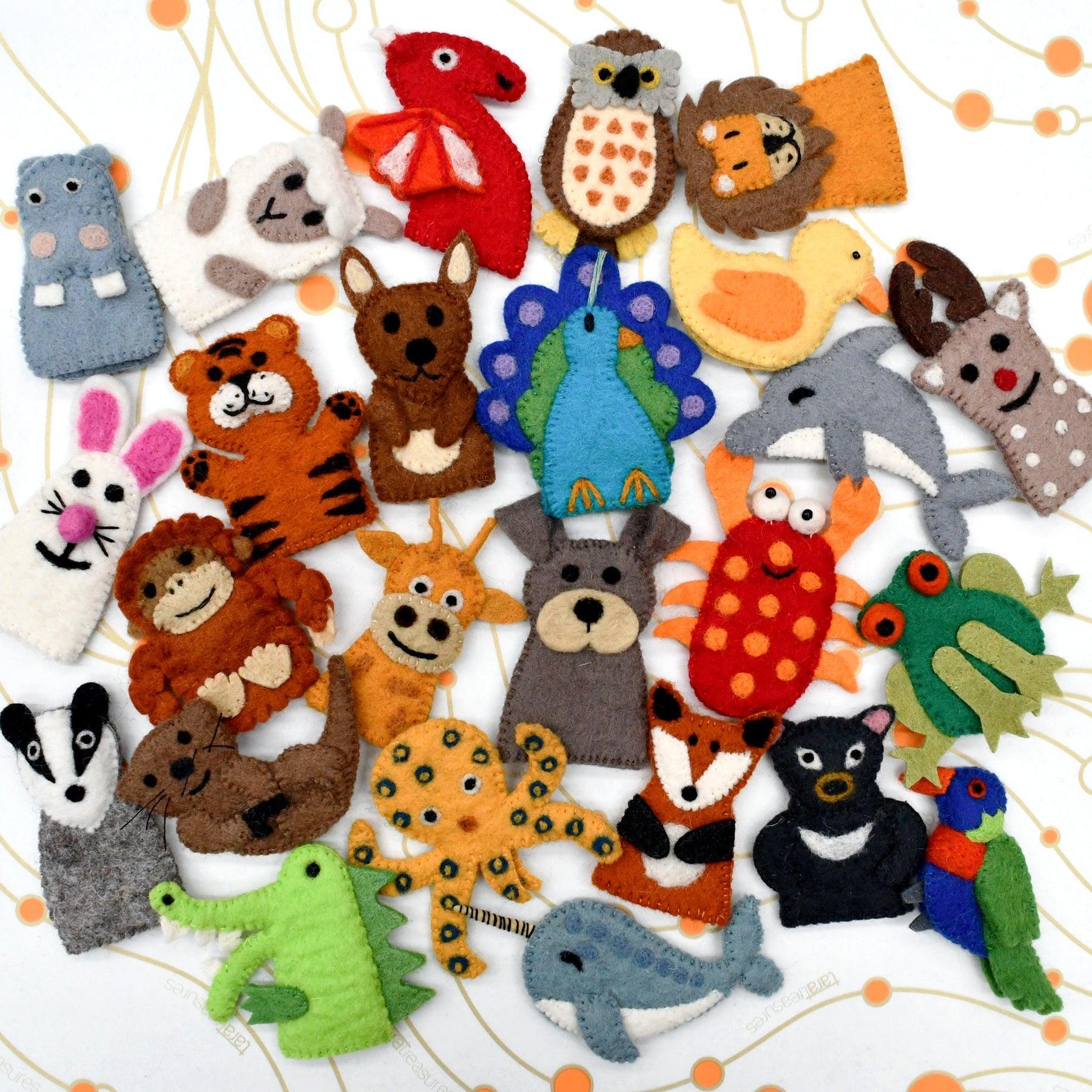 Collection of colorful felt animal toys on a white background