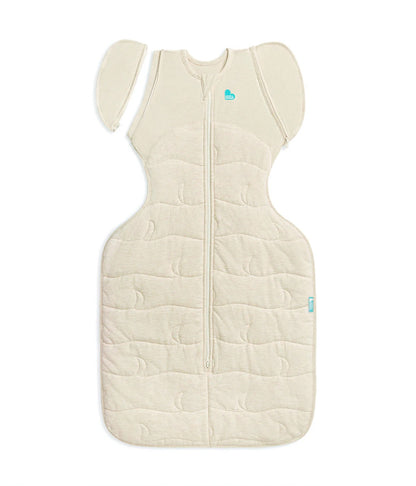 Beige baby sleeping bag with a heart logo on a white background
