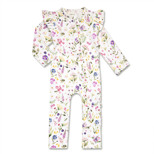 A baby long-sleeve footless one-piece jumpsuit with ruffled shoulder details, featuring a delicate watercolor floral print in pink, purple, green, and yellow on a white background.