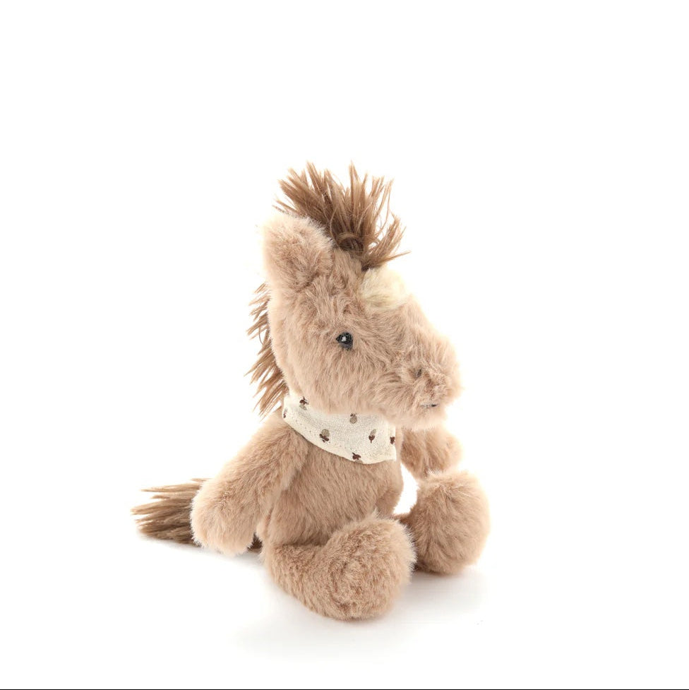 Plush horse toy with a white bandana on a white background