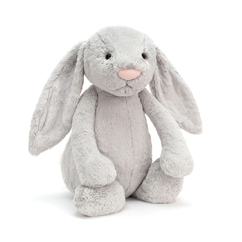 Gray plush bunny toy on a white background