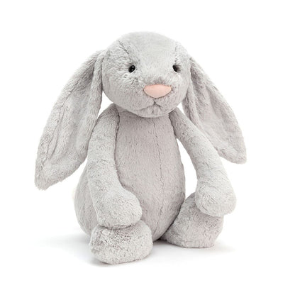 Gray plush bunny toy on a white background