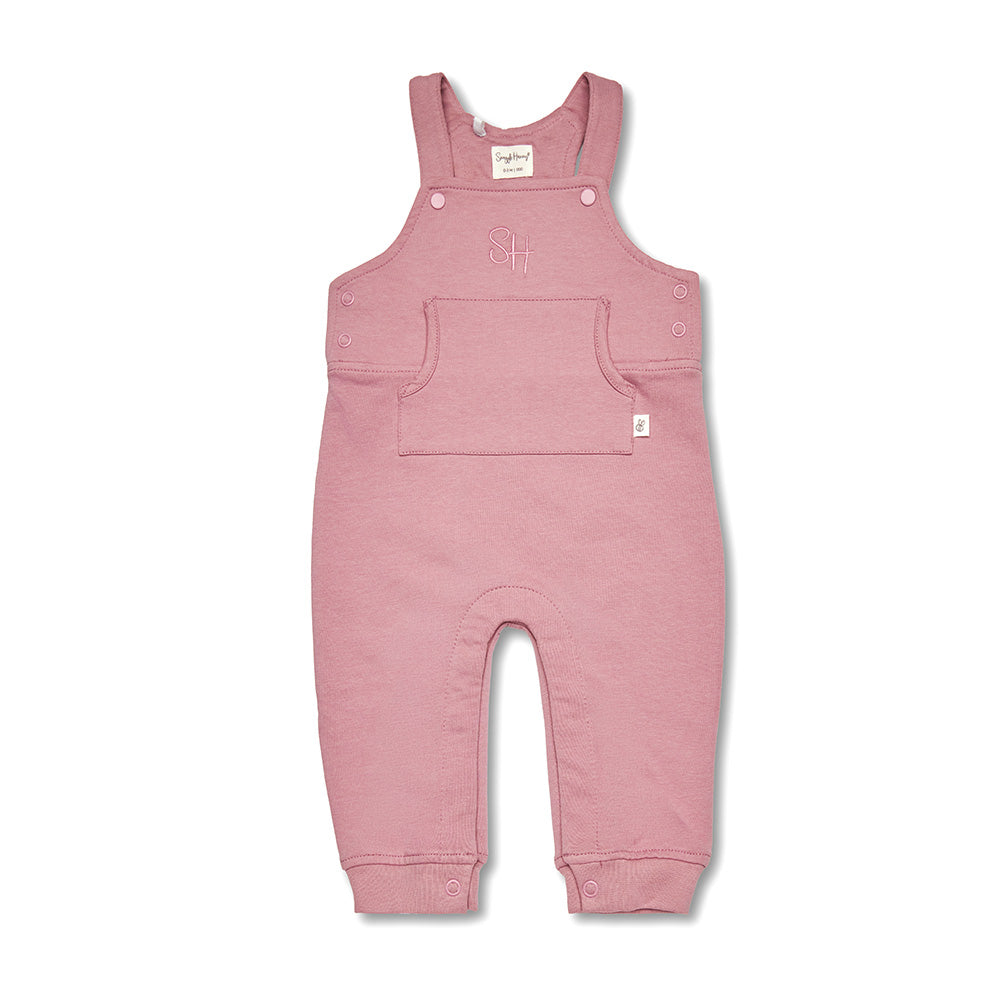 Pink baby overalls on a white background