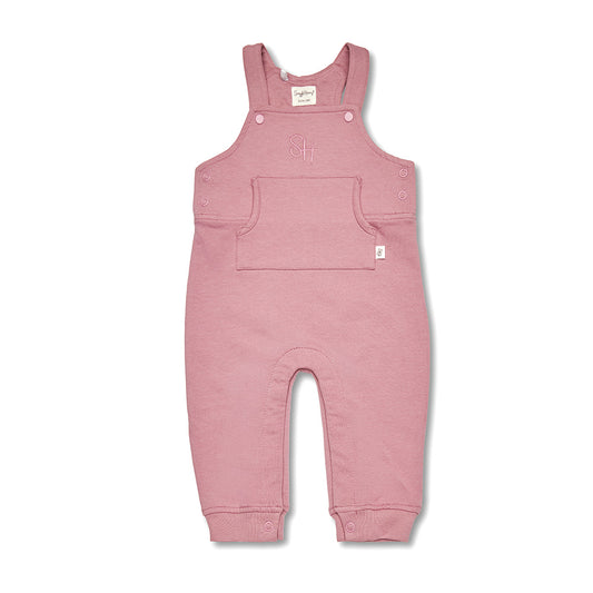 Pink baby overalls on a white background