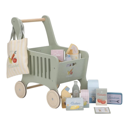 Toy shopping cart with various items on a white background