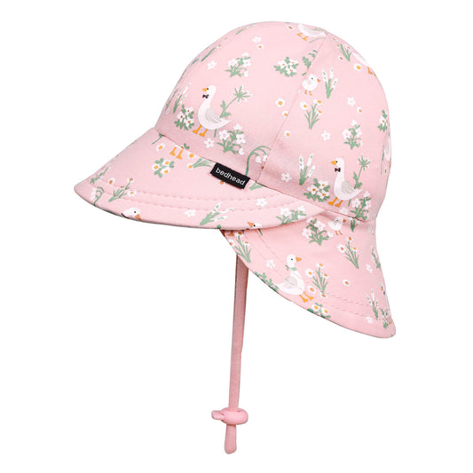 Pink children's sun hat with floral and duck pattern on a white background