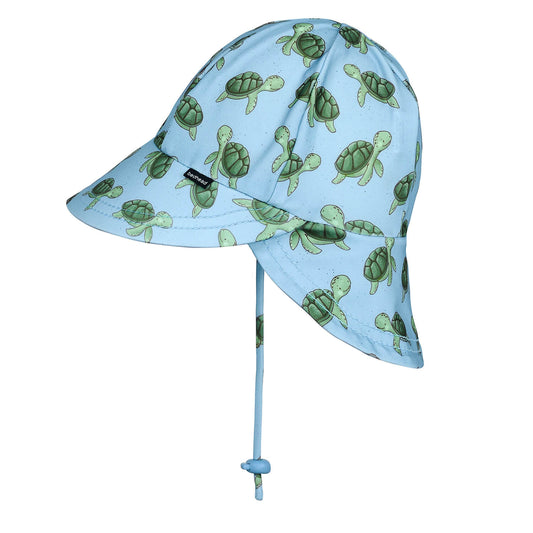 Children's sun hat with turtle pattern on a light blue background