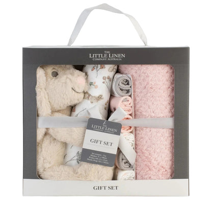 Baby gift set with plush toy, blanket, and rattle in packaging on a light gray background