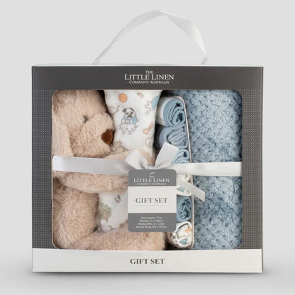 Baby gift set with teddy bear, blanket, and booties in a box labeled 'The Little Linen Company'.