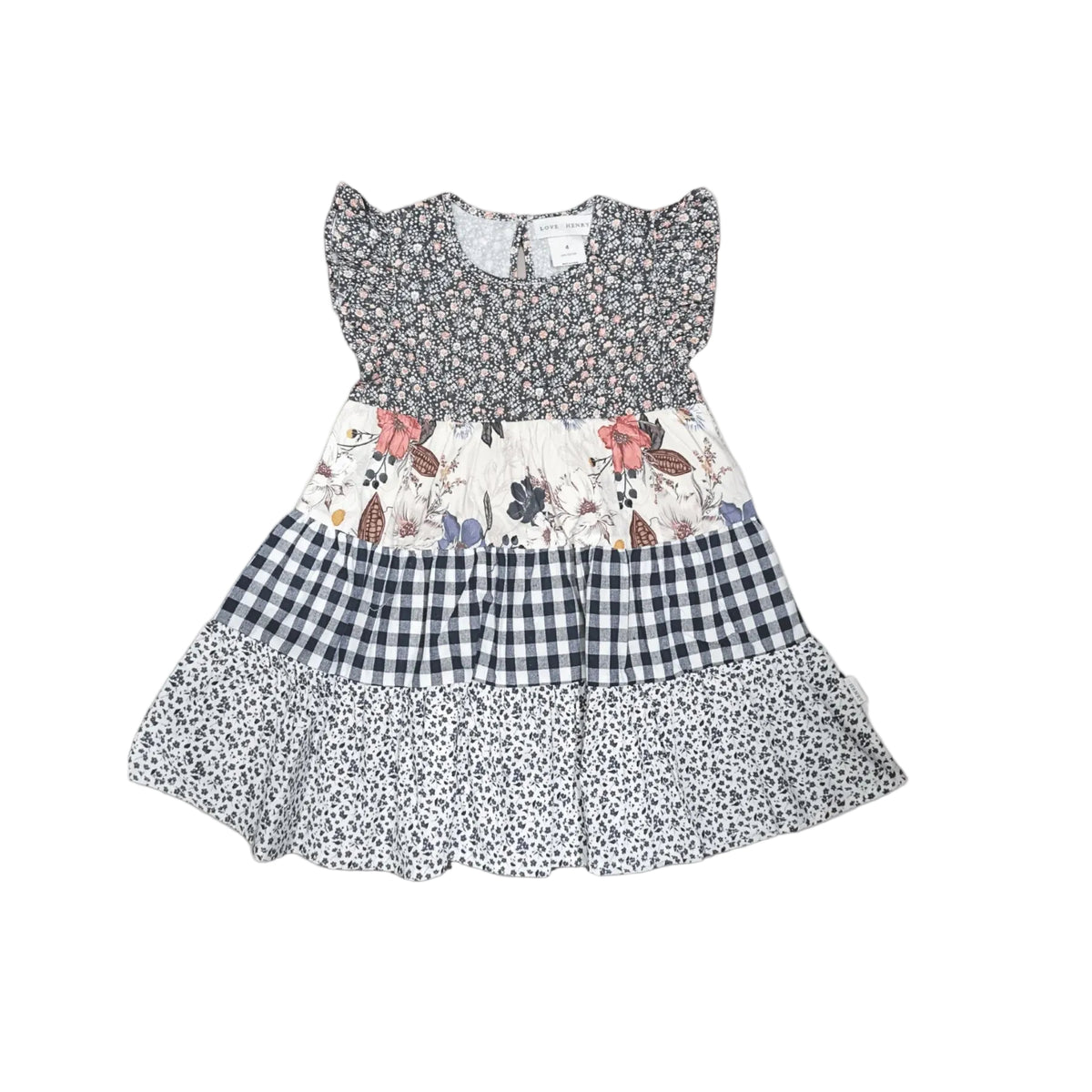 A tiered baby girl's dress with a smocked floral bodice, a central floral panel, a navy and white gingham section, and a navy and white ditsy print skirt, shown flat on a light gray background.